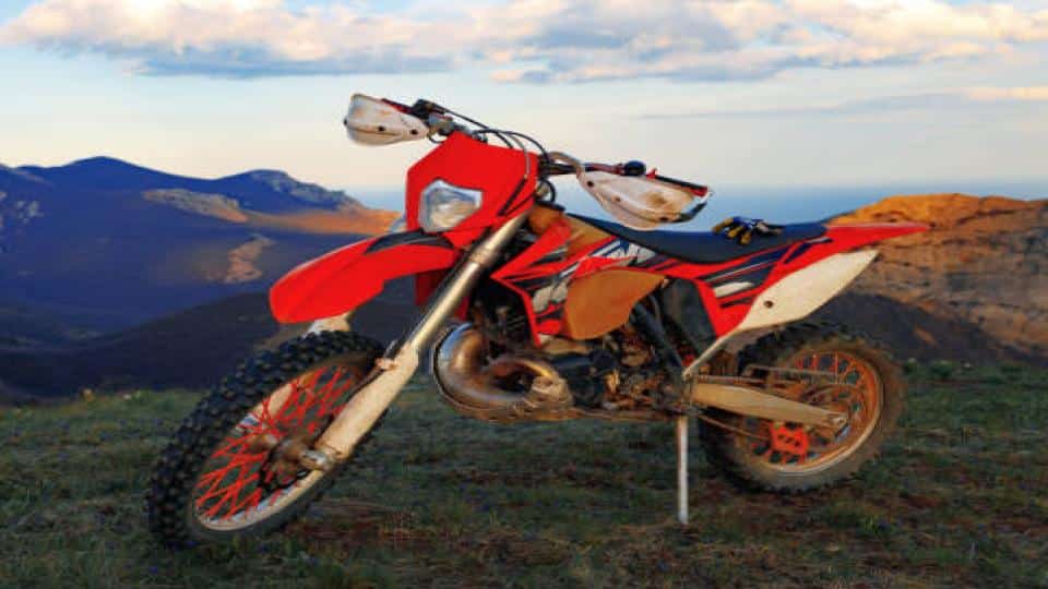 parked dirt bike with mountain view