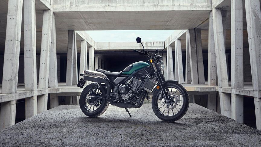 a motorcycle parked in front of a concrete structure.